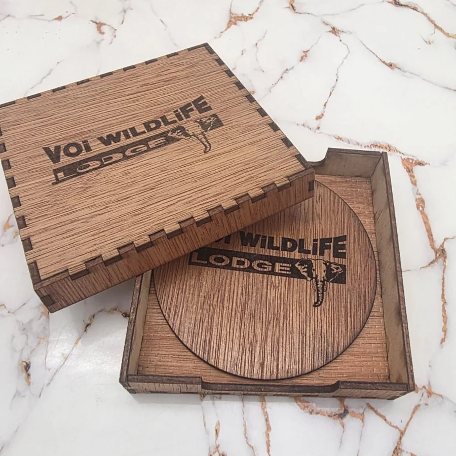 The same box with a client logo engraved into the lid and into the coaster inside